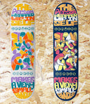 Two colorful skateboard decks with artistic designs and text on a wooden surface. Drawing Boards, A Wabi-Sabi, Series, Grey, White, 8.5, Level Skateboards, Brighton, Local Skate Shop, Independent, Skater owned and run, south coast, Level Skate Park.